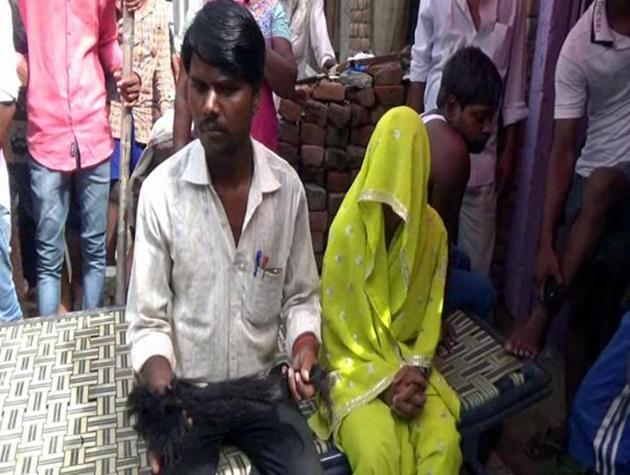 The husband showing the chopped hair of Sapna (face covered) in Bathinda.(HT Photo)