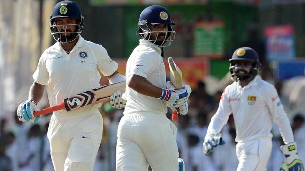 Indian cricketers Ajinkya Rahane (C) and Cheteshwar Pujara (L) scored centuries on the first day of the second Test against Sri Lanka at the Sinhalease Sports Club (SSC) Ground in Colombo on Thursday. (AFP) Indian cricketers Ajinkya Rahane (C) and Cheteshwar Pujara (L) scored centuries on the first day of the second Test against Sri Lanka at the Sinhalease Sports Club (SSC) Ground in Colombo on Thursday. (AFP)
