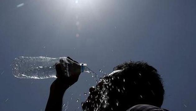 A man pours water on his face during a hot summer day in Hyderabad, India. (AP Photo) A man pours water on his face during a hot summer day in Hyderabad, India. (AP Photo)