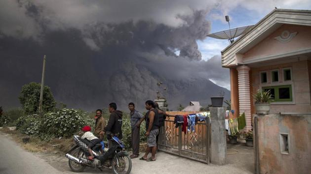 Thick, hot ash fell on nearly a dozen local villages, prompting at least one school in Kuta Rakyat to send students home. (AP)