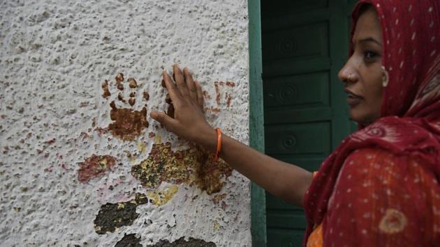 Believing that something supernatural behind the chopping of hair, villagers in Delhi have put hand imprints on the walls, hung lemon and chillies on the door and organised hawans to ward off the ‘evil’. (Saumya Khandelwal/HT Photo) Believing that something supernatural behind the chopping of hair, villagers in Delhi have put hand imprints on the walls, hung lemon and chillies on the door and organised hawans to ward off the ‘evil’. (Saumya Khandelwal/HT Photo)