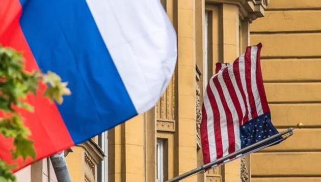 A Russian flag flies next to the US embassy building in Moscow on July 31, 2017. President Vladimir Putin on July 30, 2017 said the United States would have to cut 755 diplomatic staff in Russia and warned of a prolonged gridlock in its ties after the US Congress backed new sanctions against the Kremlin. (AFP File Photo) A Russian flag flies next to the US embassy building in Moscow on July 31, 2017. President Vladimir Putin on July 30, 2017 said the United States would have to cut 755 diplomatic staff in Russia and warned of a prolonged gridlock in its ties after the US Congress backed new sanctions against the Kremlin. (AFP File Photo)