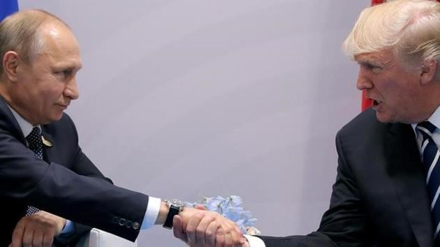 US President Donald Trump shakes hands with Russian President Vladimir Putin during the their bilateral meeting at the G20 summit in Hamburg, Germany on July 7. (Reuters) US President Donald Trump shakes hands with Russian President Vladimir Putin during the their bilateral meeting at the G20 summit in Hamburg, Germany on July 7. (Reuters)