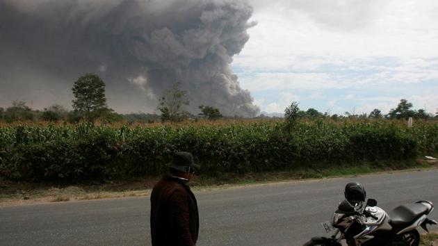 Volcanic ash is seen following an eruption of Mount Sinabung volcano, in Beganding Village. The volcano has been erupting sporadically ever since, killing 17 people and forcing more than 30,000 to evacuate their villages. (YT Haryono/ REUTERS)