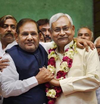 JD (U) leaders Sharad Yadav and Nitish Kumar: will they hug and make peace? (PTI file photo) JD (U) leaders Sharad Yadav and Nitish Kumar: will they hug and make peace? (PTI file photo)