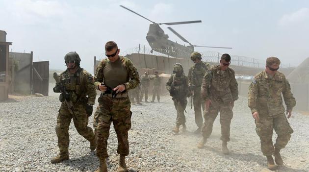 U.S. Army soldiers walk as a NATO helicopter flies overhead at coalition force Forward Operating Base (FOB) Connelly in the Khogyani district in the eastern province of Nangarhar on August 13, 2015. (AFP/Getty Images File) U.S. Army soldiers walk as a NATO helicopter flies overhead at coalition force Forward Operating Base (FOB) Connelly in the Khogyani district in the eastern province of Nangarhar on August 13, 2015. (AFP/Getty Images File)