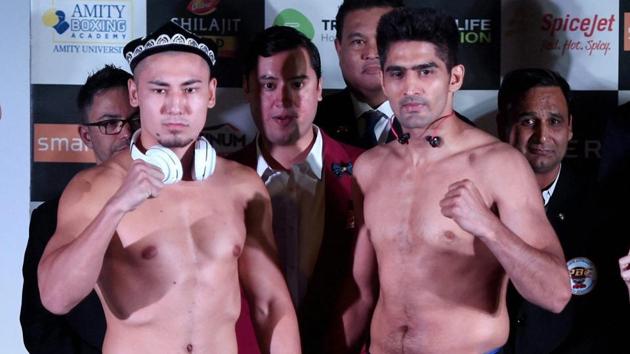 Vijender Singh and Zulpilkar Maimaitiali during their weigh-in and face-off for 'Battleground Asia’. (PTI) Vijender Singh and Zulpilkar Maimaitiali during their weigh-in and face-off for 'Battleground Asia’. (PTI)