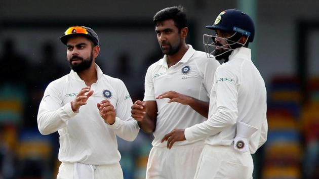 India's Ravichandran Ashwin celebrates with captain Virat Kohli after taking the wicket of Sri Lanka's Dimuth Karunaratne.Catch full cricket score of India vs Sri Lanka, 2nd Test, Day 2, here (REUTERS) India's Ravichandran Ashwin celebrates with captain Virat Kohli after taking the wicket of Sri Lanka's Dimuth Karunaratne.Catch full cricket score of India vs Sri Lanka, 2nd Test, Day 2, here (REUTERS)