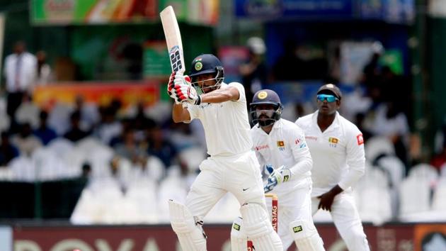 Wriddhiman Saha came in to bat and added to Sri Lanka’s woes by scoring a fifty of his own. (REUTERS)