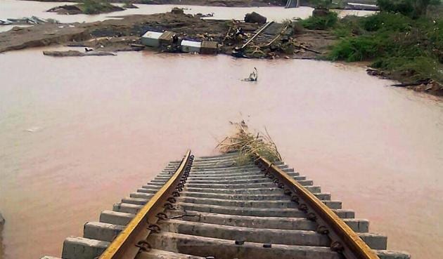 A part of the Bhaildi-Palanpur railway track has been washed away after heavy rains in Patan district. Congress vice-president Rahul Gandhi is expected to visit some of the worst hit villages in north Gujarat on Friday.(PTI)