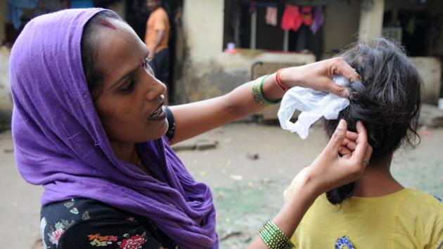 Cases of women’s hair being chopped first cropped up in Rajasthan where a WhatsApp message began doing the rounds warning people that a tantric would cut off the hair of young girls, leaving a trishul (a weapon representative of Lord Shiva) mark on the body. With little done to dispel the superstition in the beginning, the message and reports of such instances spread far and wide. A 60-year old Dalit woman in Agra became the first casualty of mass hysteria after she was lynched over suspicion of being out to chop women’s hair. (Parveen Kumar / HT Photo) Cases of women’s hair being chopped first cropped up in Rajasthan where a WhatsApp message began doing the rounds warning people that a tantric would cut off the hair of young girls, leaving a trishul (a weapon representative of Lord Shiva) mark on the body. With little done to dispel the superstition in the beginning, the message and reports of such instances spread far and wide. A 60-year old Dalit woman in Agra became the first casualty of mass hysteria after she was lynched over suspicion of being out to chop women’s hair. (Parveen Kumar / HT Photo)
