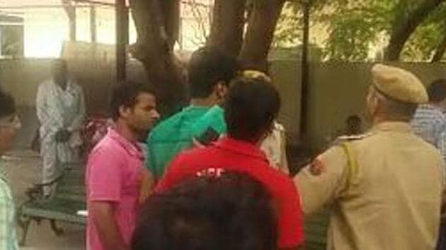 Police officials at the morgue after the firing incident that took place outside the Mahatma Gandhi Hospital on Friday. (HT Photo)