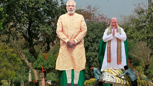 Giant cardboard cut outs of Prime Minister Narendra Modi and Amit Shah are displayed in New Delhi. (Reuters File Photo) Giant cardboard cut outs of Prime Minister Narendra Modi and Amit Shah are displayed in New Delhi. (Reuters File Photo)