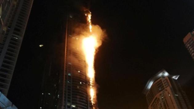 Flames shoot up the sides of the Torch tower residential building in the Marina district, Dubai, United Arab Emirates, in this August 4, 2017 picture by Mitch Williams.(Reuters Photo)