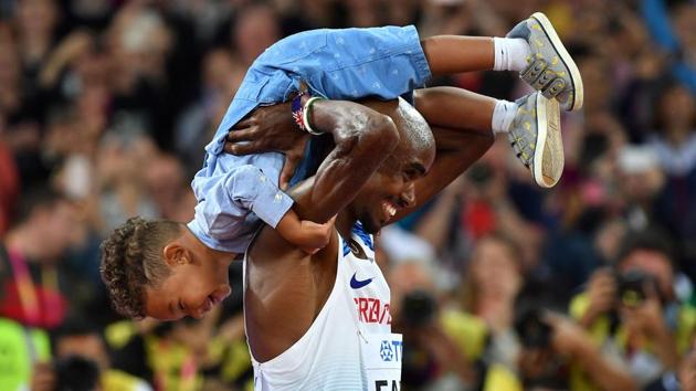 Britain's Mo Farah celebrates with his son after winning the final of the men's 10,000m race at the 2017 IAAF World Championships in London on Friday.(AFP) Britain's Mo Farah celebrates with his son after winning the final of the men's 10,000m race at the 2017 IAAF World Championships in London on Friday.(AFP)