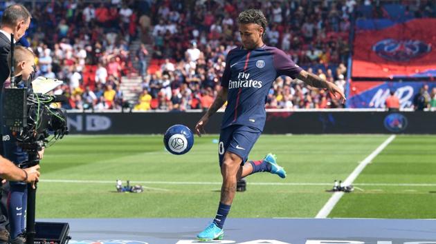 Paris Saint-Germain's Brazilian forward Neymar plays with a ball on stage during his presentation to the fans at the Parc des Princes stadium in Paris on August 5. (AFP) Paris Saint-Germain's Brazilian forward Neymar plays with a ball on stage during his presentation to the fans at the Parc des Princes stadium in Paris on August 5. (AFP)
