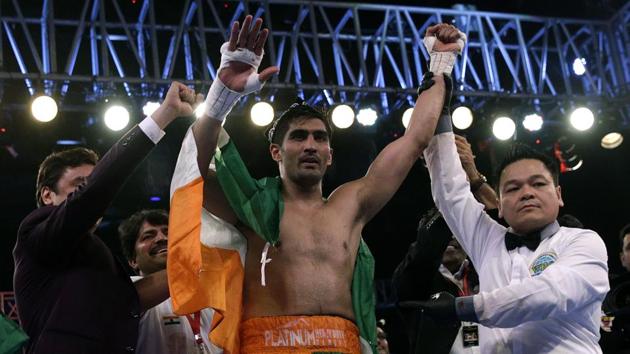 Indian boxing and WBO Asia-Pacific Super Middleweight champion Vijender Singh celebrates after winning the double title against WBO Oriental Super Middleweight champion of China Zulpikar Maimaitiali in Mumbai on Saturday. (AP) Indian boxing and WBO Asia-Pacific Super Middleweight champion Vijender Singh celebrates after winning the double title against WBO Oriental Super Middleweight champion of China Zulpikar Maimaitiali in Mumbai on Saturday. (AP)