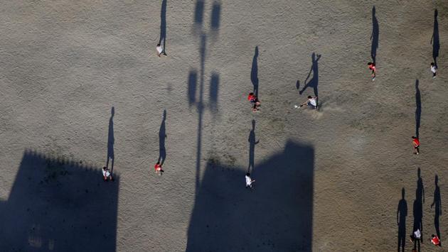 Men play soccer at a field on the outskirts of Rio de Janeiro, Brazil. (REUTERS)