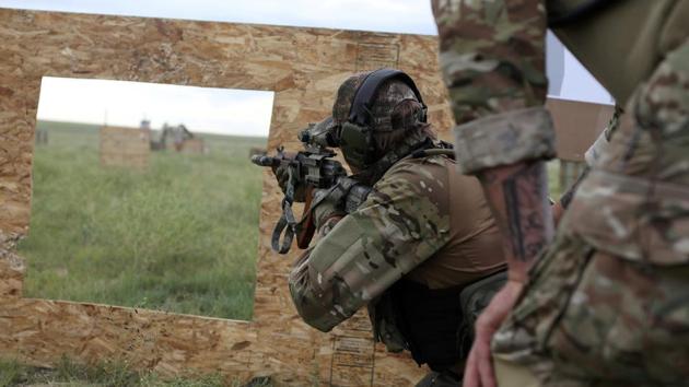 Members of self-described patriot groups and militias run through shooting drills during III% United Patriots Field Training Exercise, which they describe as the largest patriot event in the country, outside Fountain, Colorado, U.S. (REUTERS)
