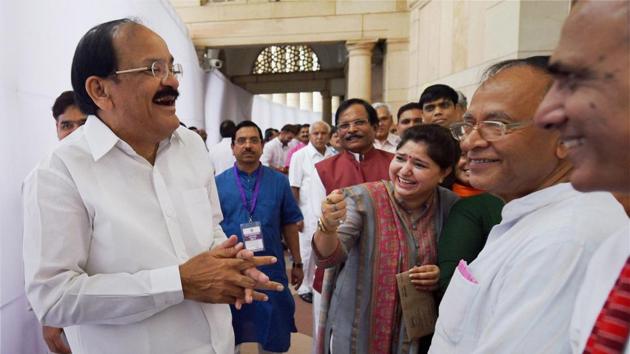 Venkaiah Naidu sharing a light moment with other MPs as he arrives to cast his vote in the vice presidential election on Saturday. (PTI Photo) Venkaiah Naidu sharing a light moment with other MPs as he arrives to cast his vote in the vice presidential election on Saturday. (PTI Photo)