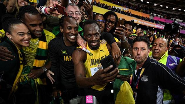 Usain Bolt takes time out to capture the moment with his family and supporters during the lap of honour after his the final of the 100m race at the IAAF World Championships of Athletics in London on Saturday. Bolt finished the last 100m race of his career in third place, with American Justin Gatlin winning it ahead of Christian Coleman. (Getty Images) Usain Bolt takes time out to capture the moment with his family and supporters during the lap of honour after his the final of the 100m race at the IAAF World Championships of Athletics in London on Saturday. Bolt finished the last 100m race of his career in third place, with American Justin Gatlin winning it ahead of Christian Coleman. (Getty Images)