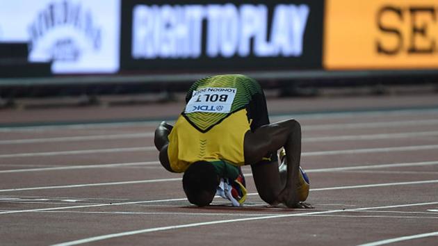 Usain Bolt kisses the track just after the men’s 100m race at the IAAF World Championships of Athletics on Saturday. (Getty Images)