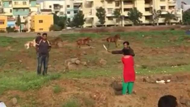 The suspect , who is a cab driver, took his wife near Morwadi naka where an argument broke in between them where they accused each other over an alleged extra-marital affair. (Video grab) The suspect , who is a cab driver, took his wife near Morwadi naka where an argument broke in between them where they accused each other over an alleged extra-marital affair. (Video grab)