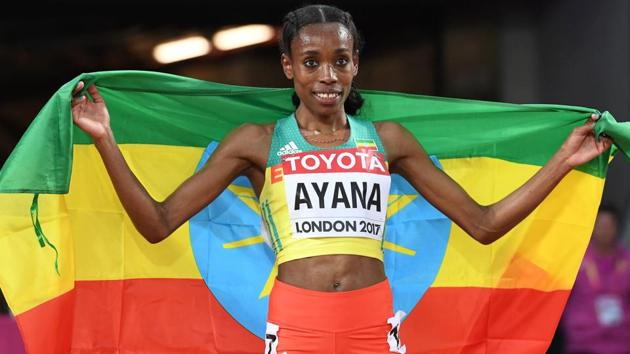 Ethiopia's Almaz Ayana celebrates after winning the final of the women's 10,000m athletics event.(AFP)