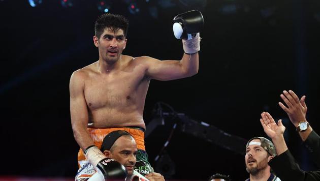 The new WBO Oriental Super Middleweight and Asia-Pacific Super Middleweight champion, Vijender Singh, gets hoisted by his support crew soon after the bout against Zulpikar Maimaitiali. (AFP)