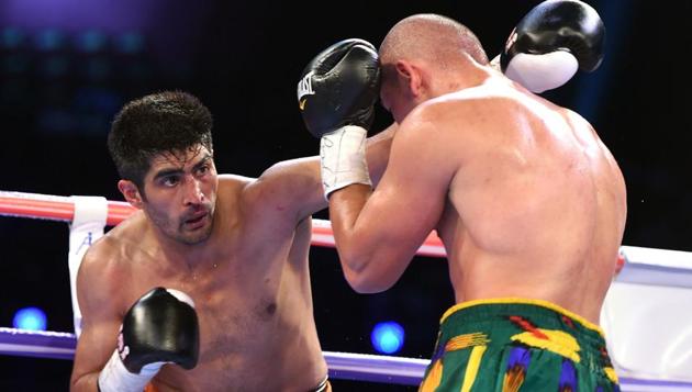 After initial exchanges from both boxers testing each other, Vijender Singh (L) started dictating terms against Zulpikar Maimaitiali with his precise jabs and counter punches during during their double title bout at the National Sports Complex of India (NSCI) Dome in Mumbai on Saturday. (AFP)