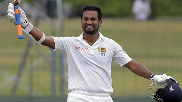 Sri Lanka’s Dimuth Karunaratne raises his bat to celebrate after scoring a century during their second Test match against India. (AP) Sri Lanka’s Dimuth Karunaratne raises his bat to celebrate after scoring a century during their second Test match against India. (AP)