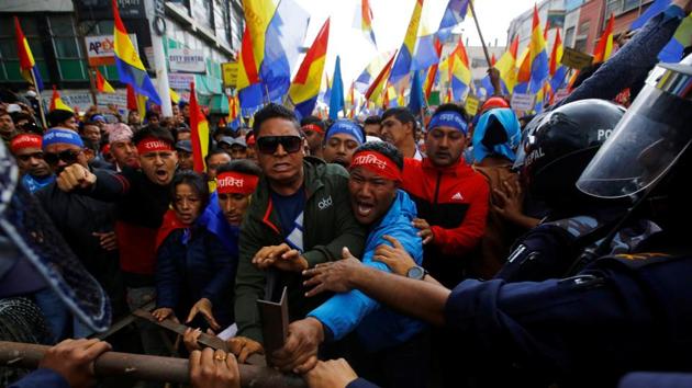 Hindu activists affiliated with Rastriya Prajatantra Party Nepal try to break through the barricade as they march towards the Election Commission during their protest after the election commission rejected their campaigning for monarchy and Hinduism in Kathmandu on March 20. (REUTERS FILE) Hindu activists affiliated with Rastriya Prajatantra Party Nepal try to break through the barricade as they march towards the Election Commission during their protest after the election commission rejected their campaigning for monarchy and Hinduism in Kathmandu on March 20. (REUTERS FILE)