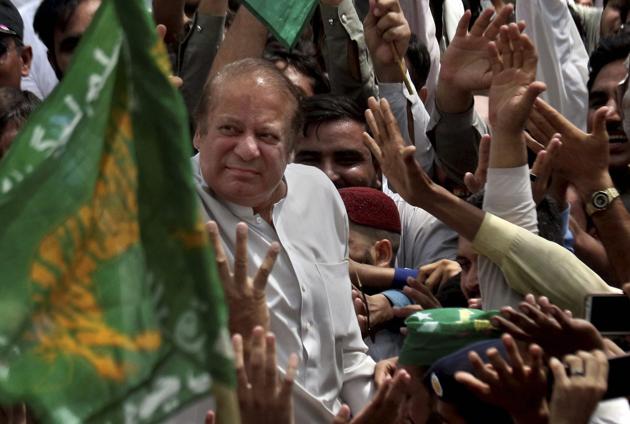 Nawaz Sharif is welcomed by supporters at Bhara Kahu area, on the outskirts of Islamabad. (AP) Nawaz Sharif is welcomed by supporters at Bhara Kahu area, on the outskirts of Islamabad. (AP)