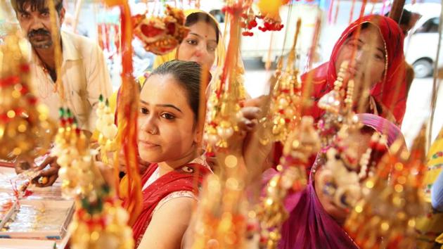 Women choose rakhi on the eve of Rakshabandhan in Jaipur on Sunday. (Himanshu Vyas/HT Photo) Women choose rakhi on the eve of Rakshabandhan in Jaipur on Sunday. (Himanshu Vyas/HT Photo)