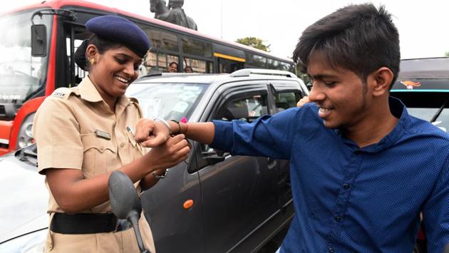Wings Foundation & Navi Mumbai Police organised Raksha Bandhan Day for Awareness of road safety during which Police official tie Rakhi on the hands of people who break the traffic rules at Vashi in Navi Mumbai. (Bachchan Kumar / HT Photo)