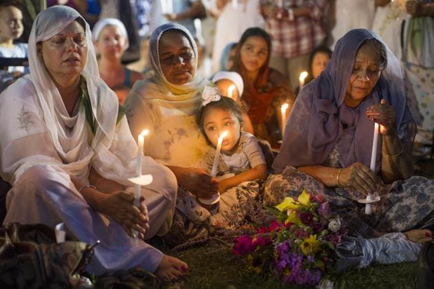 People attend a candle light vigil at the Oak Creek Civic Center on August 7, 2012, two days after a gunman shot to death six Sikhs at a gurdwara in Oak Creek, Wisconsin. (AP File) People attend a candle light vigil at the Oak Creek Civic Center on August 7, 2012, two days after a gunman shot to death six Sikhs at a gurdwara in Oak Creek, Wisconsin. (AP File)