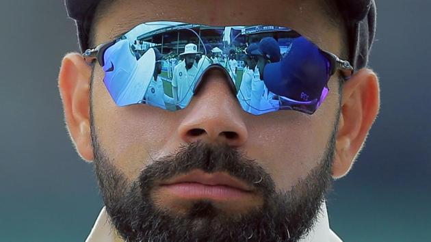 Indian players are reflected in the goggles of team captain Virat Kohli before the start of the fourth day's play of their second cricket test match against Sri Lanka in Colombo, Sri Lanka. (Eranga Jayawardena / AP) Indian players are reflected in the goggles of team captain Virat Kohli before the start of the fourth day's play of their second cricket test match against Sri Lanka in Colombo, Sri Lanka. (Eranga Jayawardena / AP)