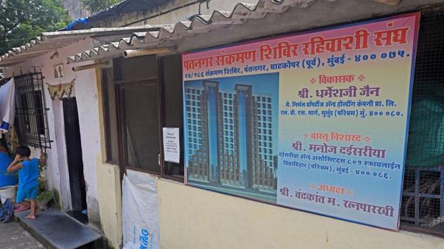A redevelopment project board at Pant Nagar transit camp in Ghatkopar. (HT) A redevelopment project board at Pant Nagar transit camp in Ghatkopar. (HT)