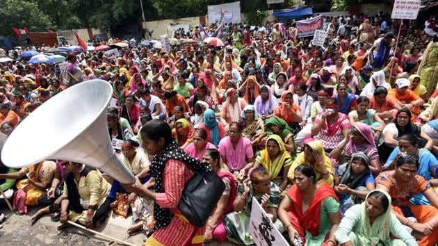 Protesting workers’ groups however remain dubious of the efficacy of this declaration by tweet, in light of non-compliance to existing legally-binding agreements from 2015. Media reports also cite claims by the workers that regardless of proclamations towards fresh pay hikes they have yet to receive pay according to their exiting slabs for over five months. (Sonu Mehta / HT Photo)