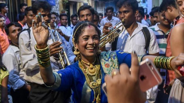 Nairyal Purnima celebrations began a day early in Worli Village on Sunday. (Kunal Patil/HT) Nairyal Purnima celebrations began a day early in Worli Village on Sunday. (Kunal Patil/HT)