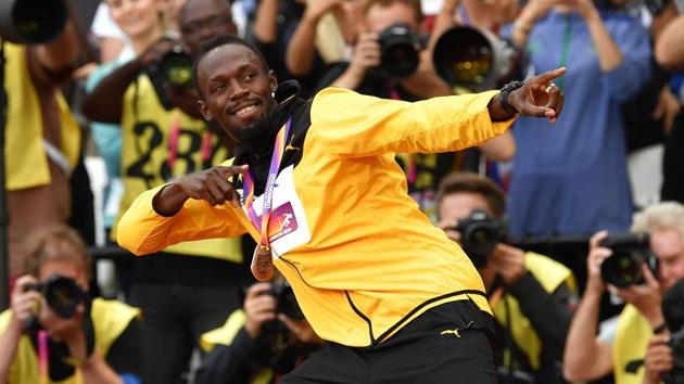 Usain Bolt demonstrates his trademark celebration for the fans one last time after the podium ceremony of the men’s 100m event at the IAAF World Championships of Athletics. (AFP)