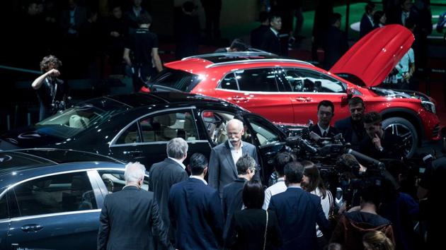 File photo of an automobile show. The GST Council plans to raise cess on SUVs and luxury cars from 15% to 25%. (AFP file) File photo of an automobile show. The GST Council plans to raise cess on SUVs and luxury cars from 15% to 25%. (AFP file)