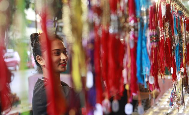 Raksha Bandhan is observed on the full moon day of the holy Hindu month of Shravan. On this festival, sisters tie the sacred thread ‘rakhi’ on their brothers’ right wrists and pray for their long lives. In turn, brothers vow to protect their sisters and gift them a present. (Rahul Raut/HT PHOTO)