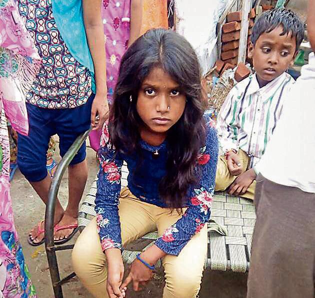 The girl, Neetu, of Nirmal Nagar in the Dugri area of Ludhiana, said she saw a “cat man” on her cot and found her hair chopped around 4pm. (HT Photo) The girl, Neetu, of Nirmal Nagar in the Dugri area of Ludhiana, said she saw a “cat man” on her cot and found her hair chopped around 4pm. (HT Photo)