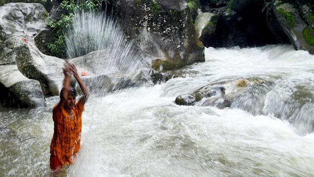 A Nepalese devotee bathes in the Bagmati river during Shravan festivities in Sundarijal, on the outskirts of Kathmandu. (PRAKASH MATHEMA/ AFP) A Nepalese devotee bathes in the Bagmati river during Shravan festivities in Sundarijal, on the outskirts of Kathmandu. (PRAKASH MATHEMA/ AFP)