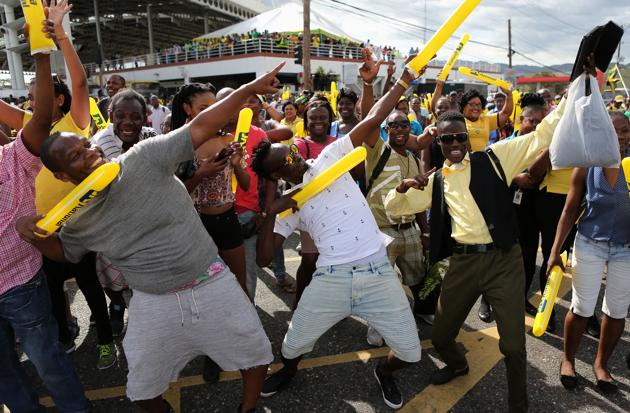 Usain Bolt’s fans back home in Kingston, Jamaica, mimicked their champion’s pose as they witnessed men’s 100m final at the IAAF World Championships of Athletics in London. (REUTERS)