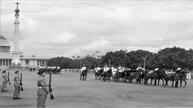 Outgoing British Governor-General Lord Mountbatten rides in a carriage alongside Lady Edwina Mountbatten prior to witnessing the raising of the Indian tricolour for the first time at India Gate, on August 15, 1947 in New Delhi. (AFP) 