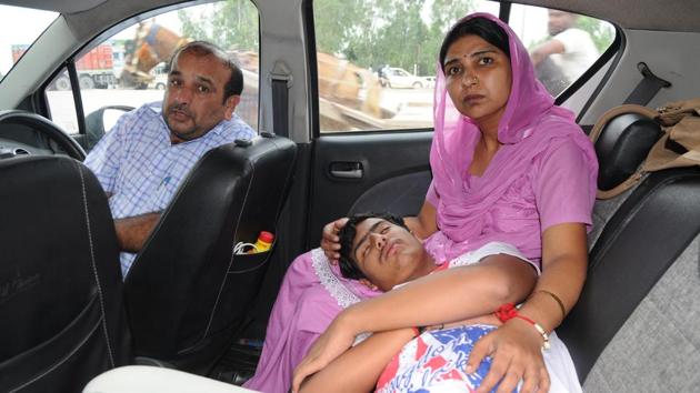 Harshit Sharma with his mother Bharti Sharma and father Rajinder Kumar Sharma on the Chandigarh-Delhi highway on Monday August 7.(Anil Dayal/HT) Harshit Sharma with his mother Bharti Sharma and father Rajinder Kumar Sharma on the Chandigarh-Delhi highway on Monday August 7.(Anil Dayal/HT)