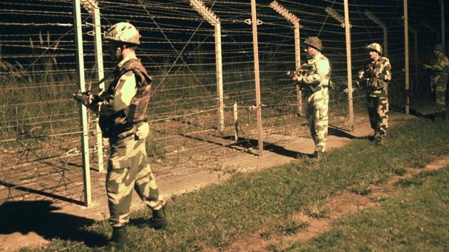 Border Security Force (BSF) soldiers standing guard during a night patrol near the fence at the India-Pakistan International Border at the outpost of Akhnoor sector, about 40 km from Jammu. (HT File Photo) Border Security Force (BSF) soldiers standing guard during a night patrol near the fence at the India-Pakistan International Border at the outpost of Akhnoor sector, about 40 km from Jammu. (HT File Photo)