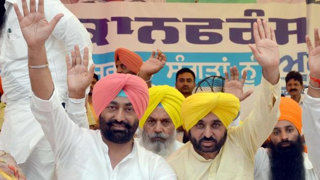 AAP MLA Sukhpal Singh Khaira (left) and AAP MLA Bhagwant Mann at Baba Bakala near Amritsar on Monday. (Sameer Sehgal/HT) AAP MLA Sukhpal Singh Khaira (left) and AAP MLA Bhagwant Mann at Baba Bakala near Amritsar on Monday. (Sameer Sehgal/HT)